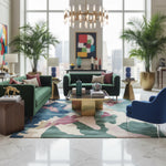 Modern living room with green sofas, a colorful rug, and decorative items.