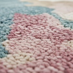 Close-up of a textured pink and blue rug