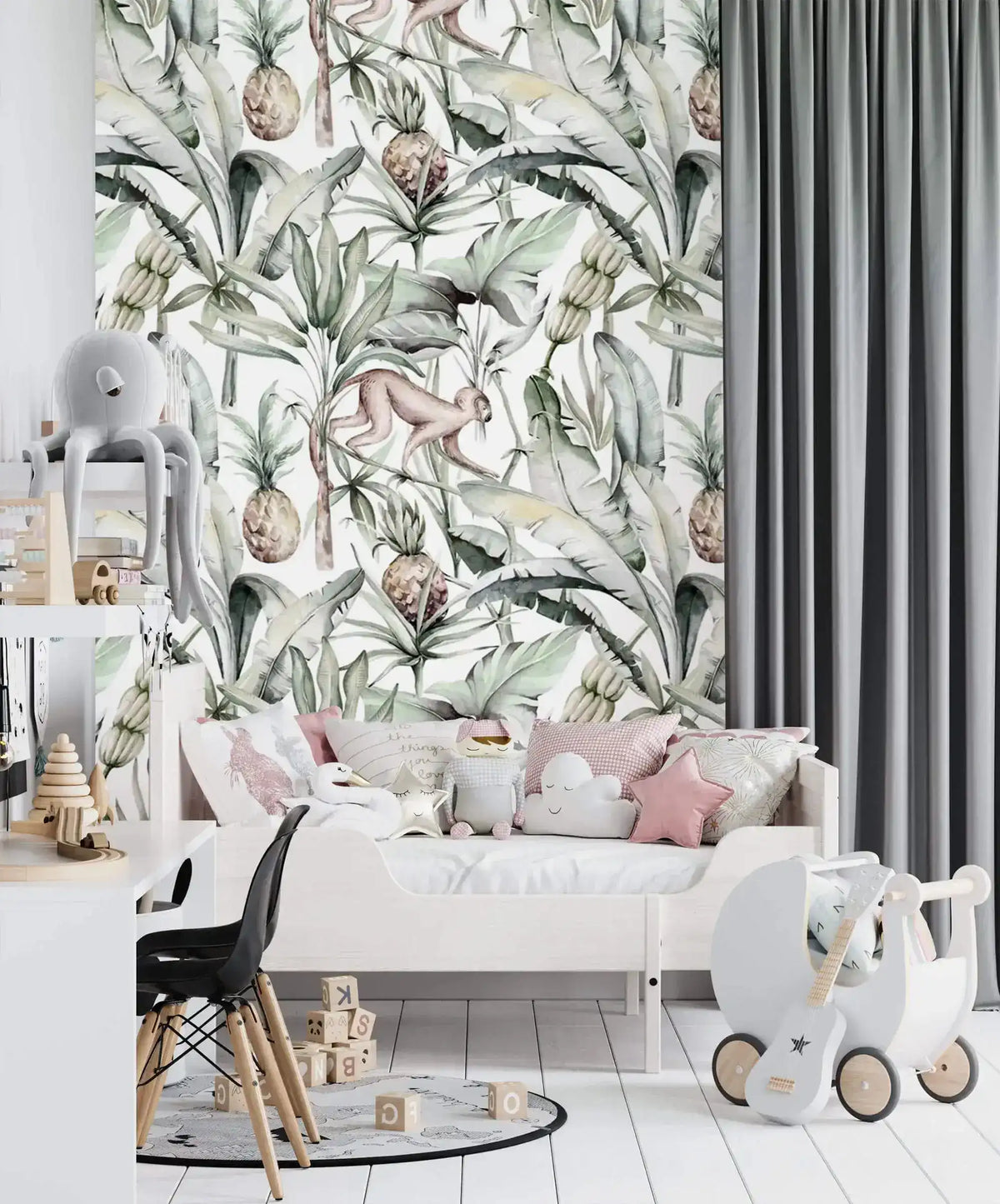 Watercolor tropical jungle wallpaper in kids room with toddler bed, pink cushions and toy pram
