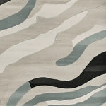 A contemporary Wave Harmony Hand Tufted Area Rug featuring an abstract design with flowing stripes in shades of gray, blue, and black. Ideal for adding style to living rooms, this 8x10 wool rug offers a modern touch to any space.
