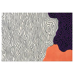 Contemporary area rug with an abstract wave design, featuring black and white wavy lines across the majority of the wool rug, contrasted by vibrant purple and orange sections, ideal for large living rooms.