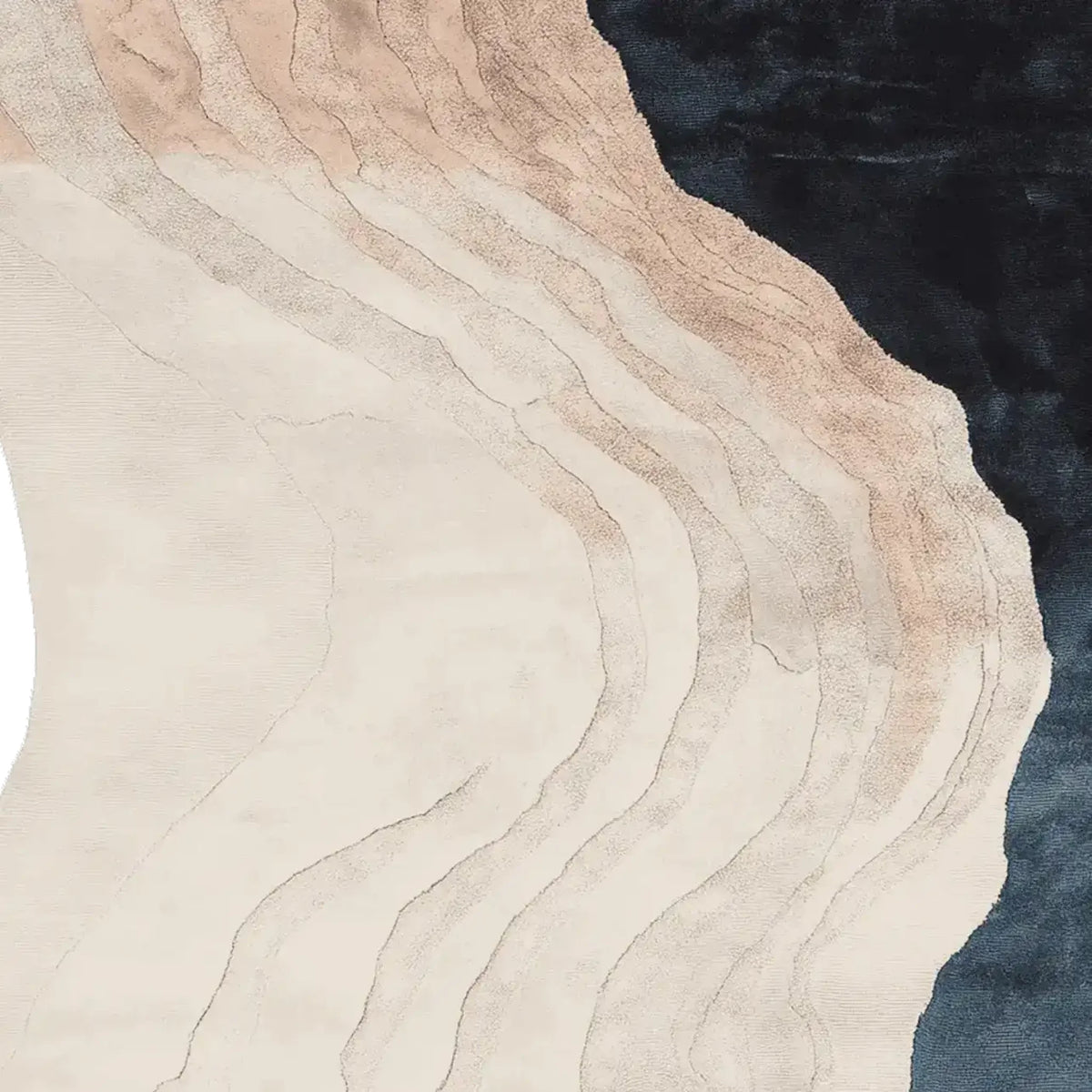 A close-up view of a Wavy Land Narrative Hand Tufted Area Rug, showcasing its abstract design with gentle earthy tones and a deep navy edge. This wool rug is perfect for adding a contemporary touch to large living rooms, offering a stylish option for rugs in the living room.