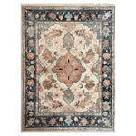 Top view of a beautifully designed area rug, showcasing a hand-tufted wool rug with intricate floral and geometric patterns. This elegant piece, perfect for area rugs for living room, features a harmonious blend of subtle colors and detailed borders, offering a touch of sophistication to any space.