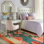 A cozy bedroom setting featuring the Whimsical Rose Reverie Hand Tufted Area Rug. This wool rug, perfect for large living rooms and living room spaces, showcases a vibrant floral design with bold roses and lush greenery. The colorful rug complements the elegant decor, creating a warm and inviting atmosphere.