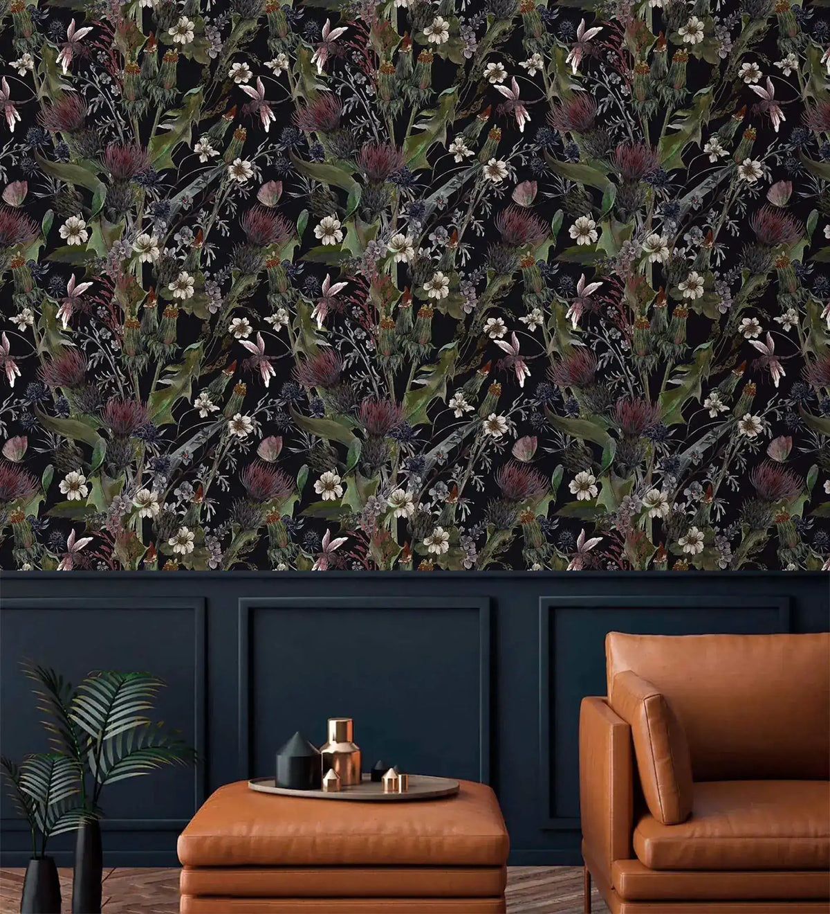 Whimsical vintage garden wallpaper with daisies and thistles on black above navy panelling and tan leather seating