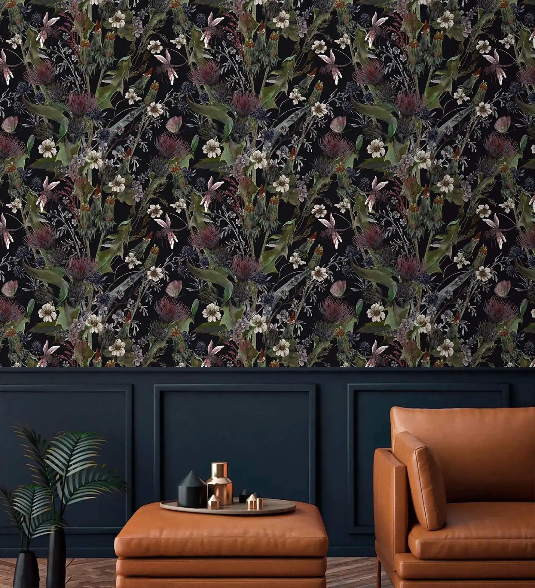 Whimsical vintage garden wallpaper with daisies and thistles on black above navy panelling and tan leather seating