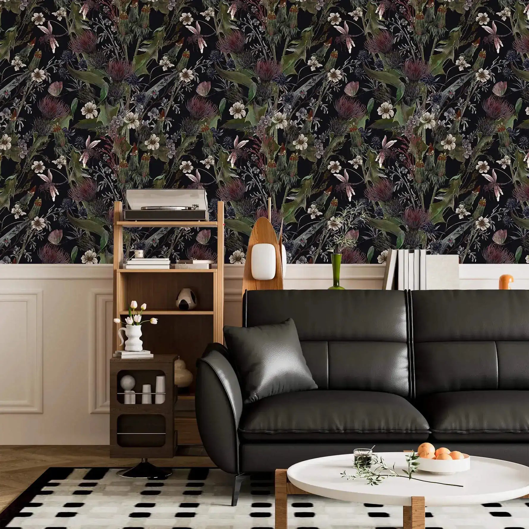 Whimsical vintage garden wallpaper with dark florals on black above wainscoting in a living room with black sofa