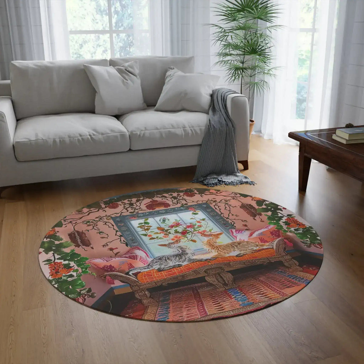 Whimsy Garden Lounge round rug in bright living room with gray sofa, wood floor, showing illustrated cats-in-garden design