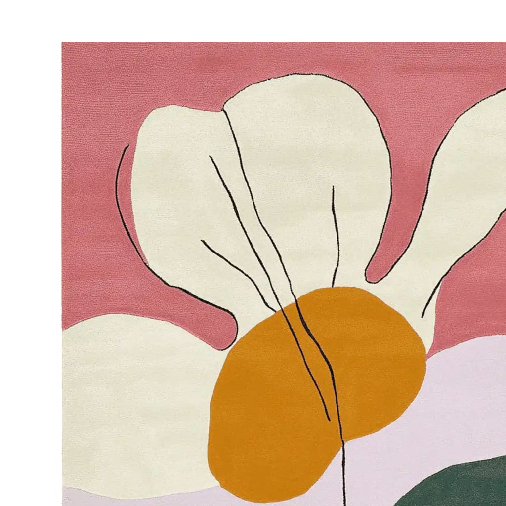 Close-up view of the Whimsy Wild Bloom Hand Tufted Area Rug featuring an abstract floral design with bold colors including pink, orange, and cream. This wool rug is perfect for adding a contemporary touch to your living room, making it an ideal choice for those seeking stylish living room area rugs.
