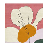 Close-up view of the Whimsy Wild Bloom Hand Tufted Area Rug featuring an abstract floral design with bold colors including pink, orange, and cream. This wool rug is perfect for adding a contemporary touch to your living room, making it an ideal choice for those seeking stylish living room area rugs.