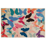 Vibrant area rug featuring a lively pattern of colorful butterflies in shades of blue, pink, orange, and black, perfect for adding a pop of color to any living room. This wool rug is hand tufted, showcasing intricate details that enhance its artistic appeal.