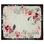 This beautiful area rug, titled 'Whispering Bloom Tale Hand Tufted Rug', showcases a stunning floral design with intricate pink and red blossoms set against a soft backdrop. Ideal for large living rooms, this wool rug adds a touch of elegance and warmth to any space.