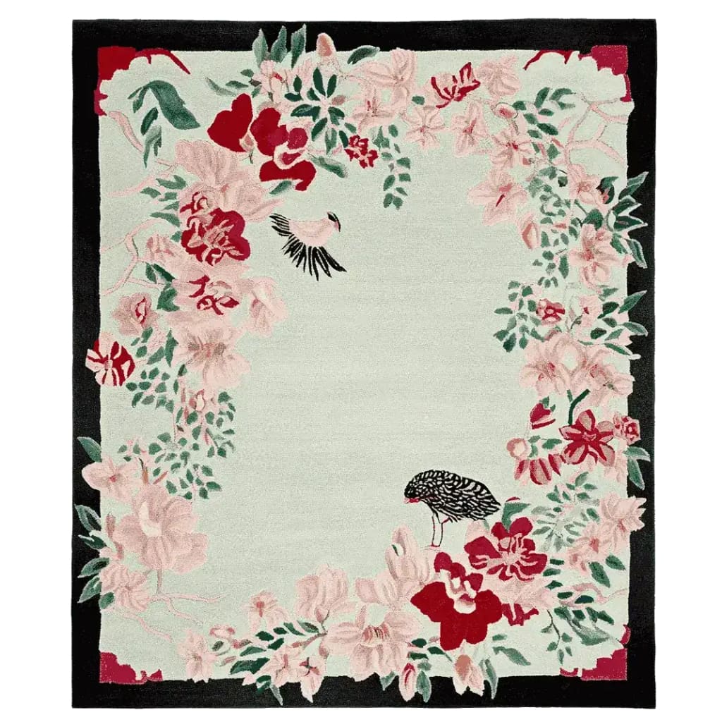 A beautifully crafted area rug featuring a floral design with pink and red blossoms against a soft green background. This wool rug is perfect for large living room spaces, adding elegance and warmth with its intricate hand-tufted details.