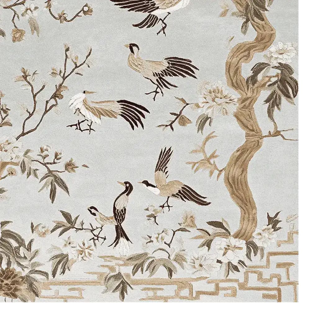 Beautifully detailed area rug showcasing a nature-inspired design with birds and branches, perfect for large living room spaces. This hand-tufted wool rug features a soft color palette, adding elegance to any living room area.