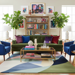 Living room with a green sofa, colorful rug, and decorative items.