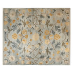 The Whispering Garden Hand Tufted Wool Rug features an intricate floral design with soft hues of yellow and grey, creating a vintage charm perfect for area rugs for living rooms. This elegant wool rug, sized at 8x10, adds a touch of sophistication to any living space.