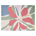 Vibrant Whispering Petal Hue hand-tufted area rug featuring an abstract floral design with bold red, green, and blue petals, perfect for adding a contemporary touch to any living room. This wool rug combines style and comfort, making it an ideal choice for those seeking area rugs for living rooms.