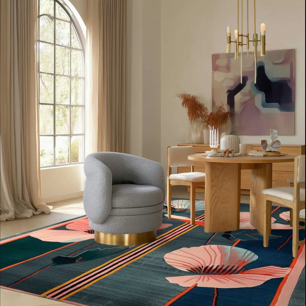 A contemporary area rug called 'Whispering Petals Hand Tufted Rug' beautifully displayed in a modern bedroom setting. This wool rug features an elegant floral design with soft pink and navy hues, adding a touch of sophistication to the room. Perfect as a bedroom rug, its vibrant patterns and luxurious texture blend seamlessly with the neutral decor, enhancing the contemporary ambiance.