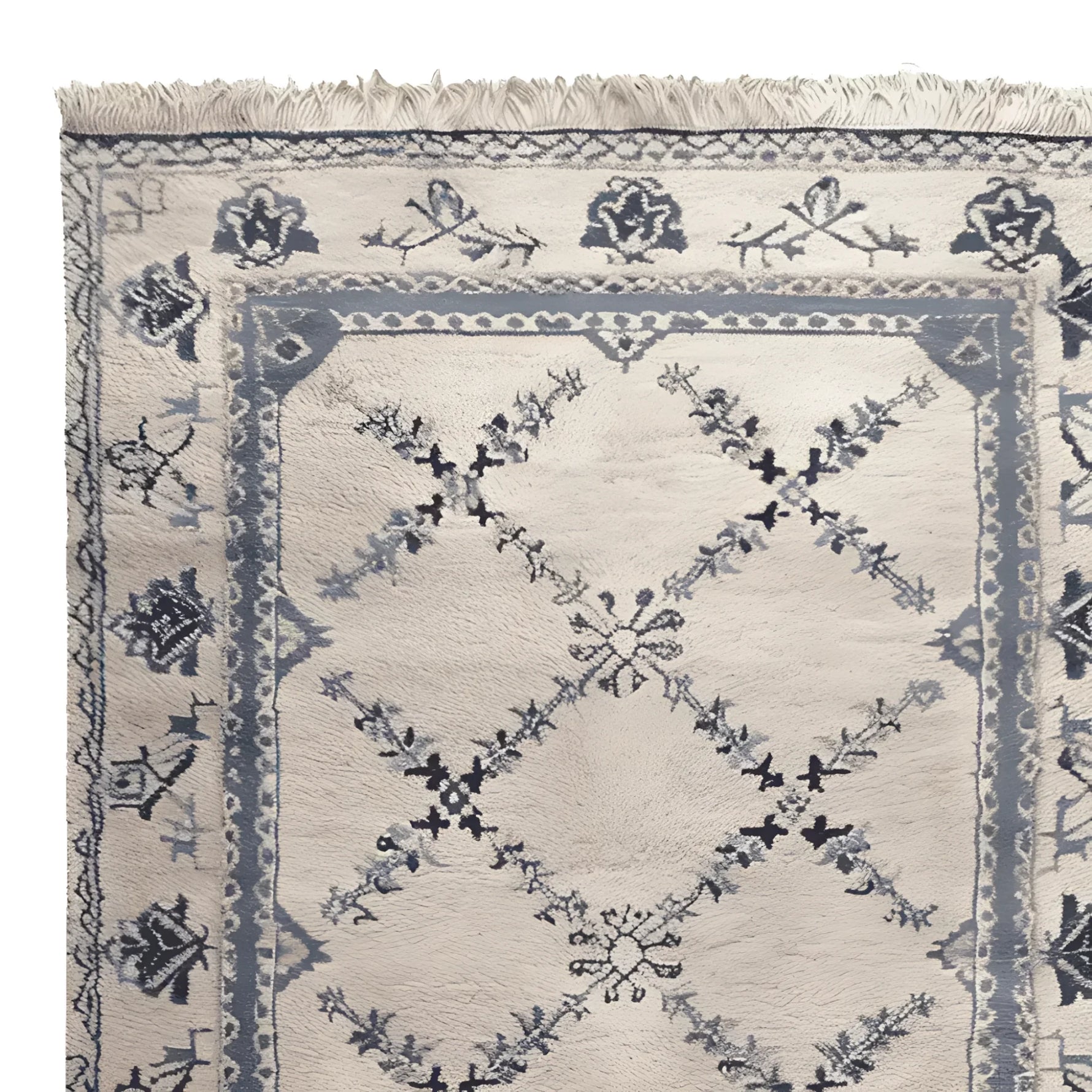 Close-up view of the Whispering Vines Hand Knotted Rug, showcasing its intricate floral and geometric patterns. This wool area rug, perfect for living rooms, features a vintage design in soft blue and cream tones, exemplifying elegance and sophistication.
