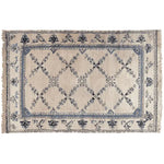 Elegant Whispering Vines Hand Knotted Area Rug featuring intricate vintage floral patterns in a soft blend of blues and creams, perfect for a cozy wool rug in the living room.