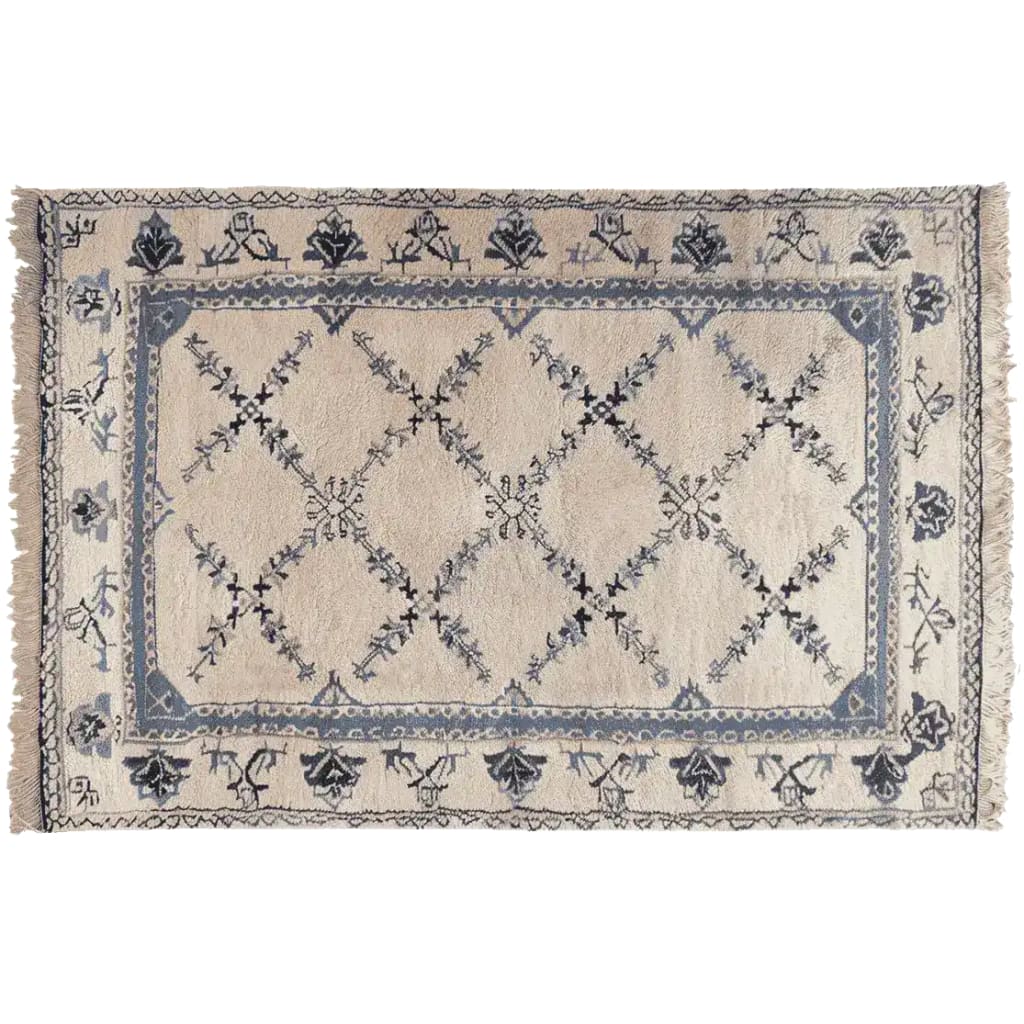 Elegant Whispering Vines Hand Knotted Area Rug featuring intricate vintage floral patterns in a soft blend of blues and creams, perfect for a cozy wool rug in the living room.