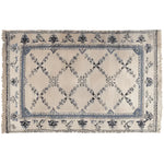 Elegant Whispering Vines Hand Knotted Area Rug featuring intricate vintage floral patterns in a soft blend of blues and creams, perfect for a cozy wool rug in the living room.