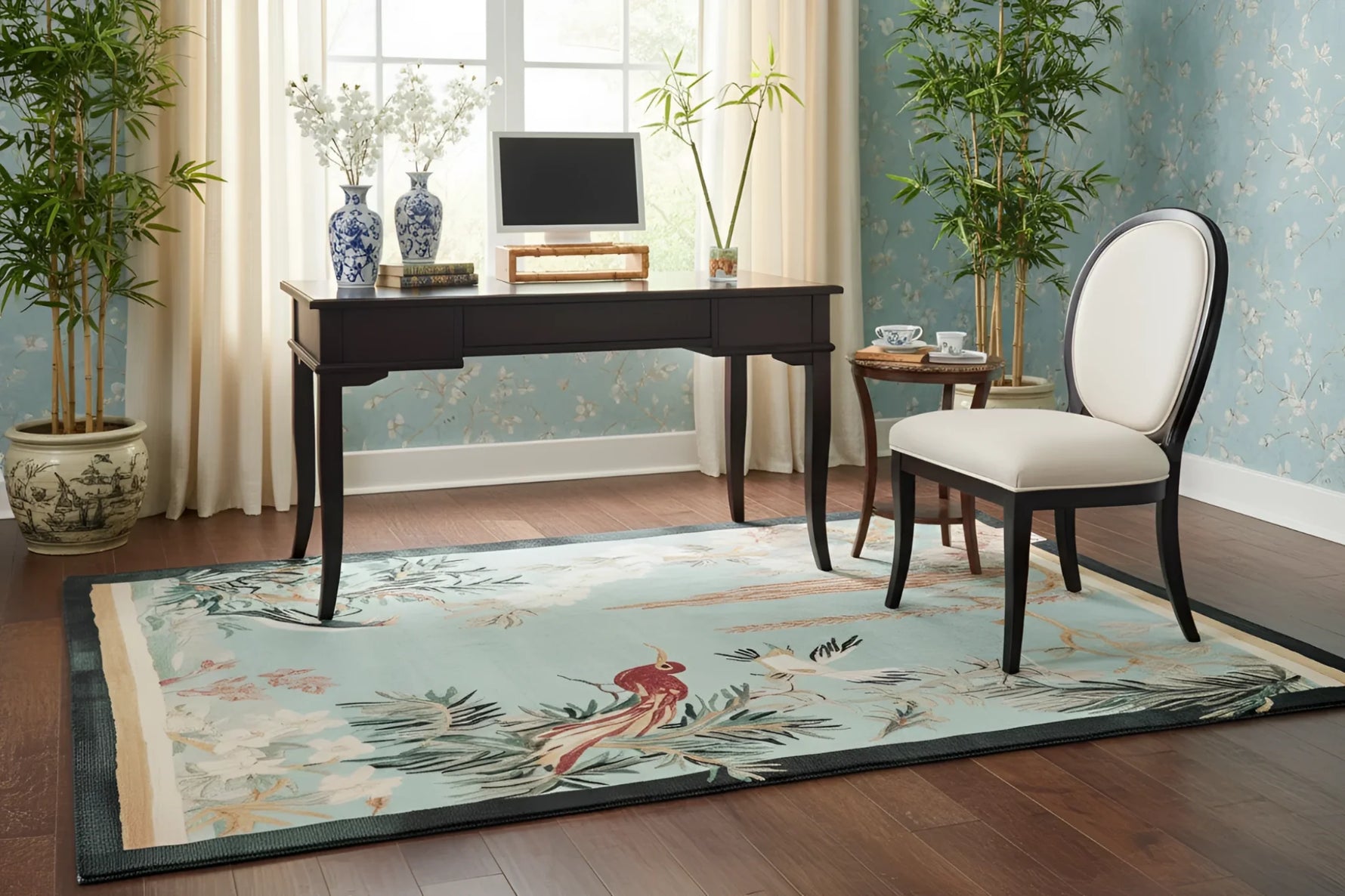 Room with a desk, chair, and a chinoiserie rug on a wooden floor.