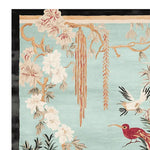 A beautiful Whispering Willow Hand Tufted Rug featuring intricate floral and bird designs on a soft pastel background. This area rug is crafted from high-quality wool, perfect for adding elegance to large living rooms. Ideal as a wool rug for enhancing the aesthetic of any space.