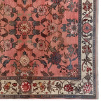 A beautifully detailed area rug featuring a rich floral pattern in warm hues, perfect for enhancing living room decor. This knotted wool rug, titled 'Whispers of Antiquity', showcases intricate designs with a classic touch, ideal for those seeking elegant floral rugs.