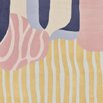 Top view of the Whispers of Color Hand Tufted Area Rug showcasing an abstract design with soft pastel hues. This wool rug features a blend of pink, blue, and yellow shapes, making it a perfect contemporary rug for a stylish living room.