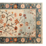 Top view of the Whispers of the Dawn Knotted Wool Rug, featuring vibrant floral designs on a soft background, perfect for adding elegance to living room rugs 8x10. This area rug showcases intricate patterns and a harmonious color palette, ideal for those seeking a stylish floral rug for their living space.