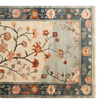 Top view of the Whispers of the Dawn Knotted Wool Rug, featuring vibrant floral designs on a soft background, perfect for adding elegance to living room rugs 8x10. This area rug showcases intricate patterns and a harmonious color palette, ideal for those seeking a stylish floral rug for their living space.