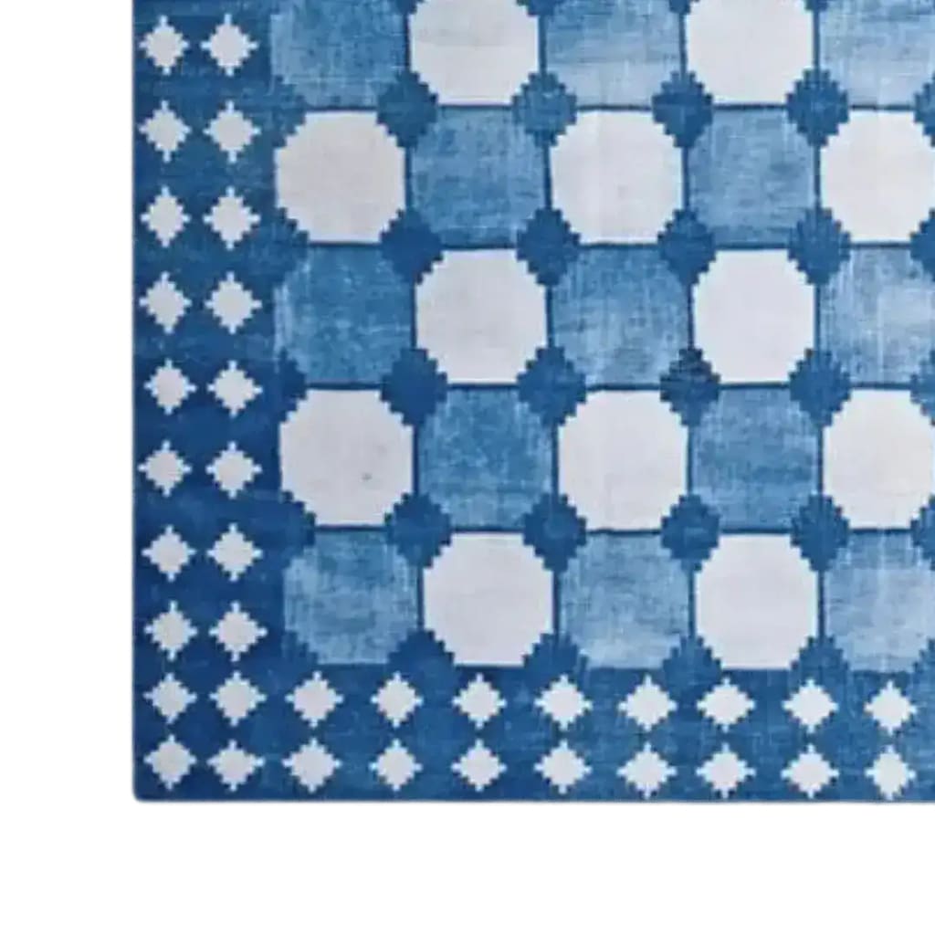 Top view of a white and blue classic dhurrie cotton area rug with a geometric pattern, ideal for boho-themed living rooms. This stylish 8x10 rug is perfect for adding a touch of elegance to your living space.