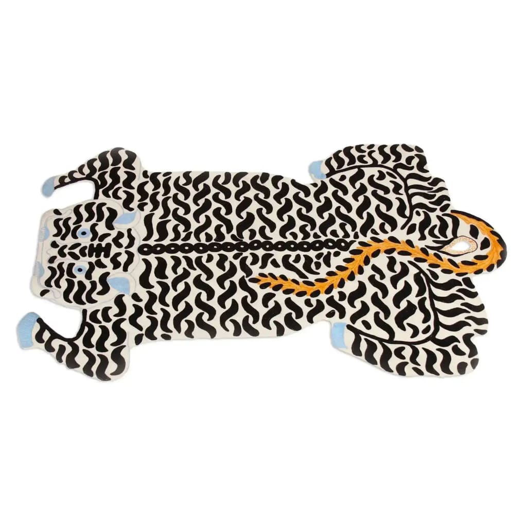 A striking White Authentic Tibetan Tiger Hand Tufted Wool Rug, designed as a large area rug perfect for living rooms or dining rooms. The rug features a bold abstract tiger pattern in black and white, with touches of blue and orange, making it an ideal choice for a formal dining room setting.
