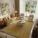 Living room with beige sofa, armchairs, and a yellow white bloom elegant hand tufted wool rug.