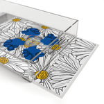 Daisy ladies in blue acrylic tray angled — clear sides, handles visible, printed daisy and lady pattern