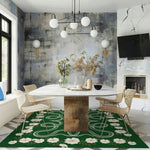 Stylish living room featuring a White Flowers Snakes Hand Tufted Area Rug in green. This large wool rug adds a boho touch to the modern space with its intricate floral design. Perfect for enhancing large areas like living rooms or bedrooms, this area rug complements the chic decor with its soft texture and elegant pattern.