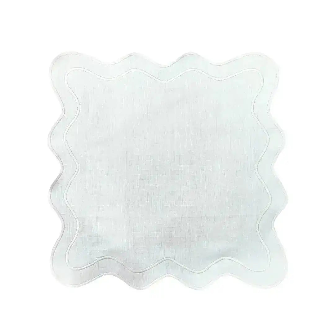 Single white scallop linen square placemat flat on white background, clean wavy border with tonal stitching