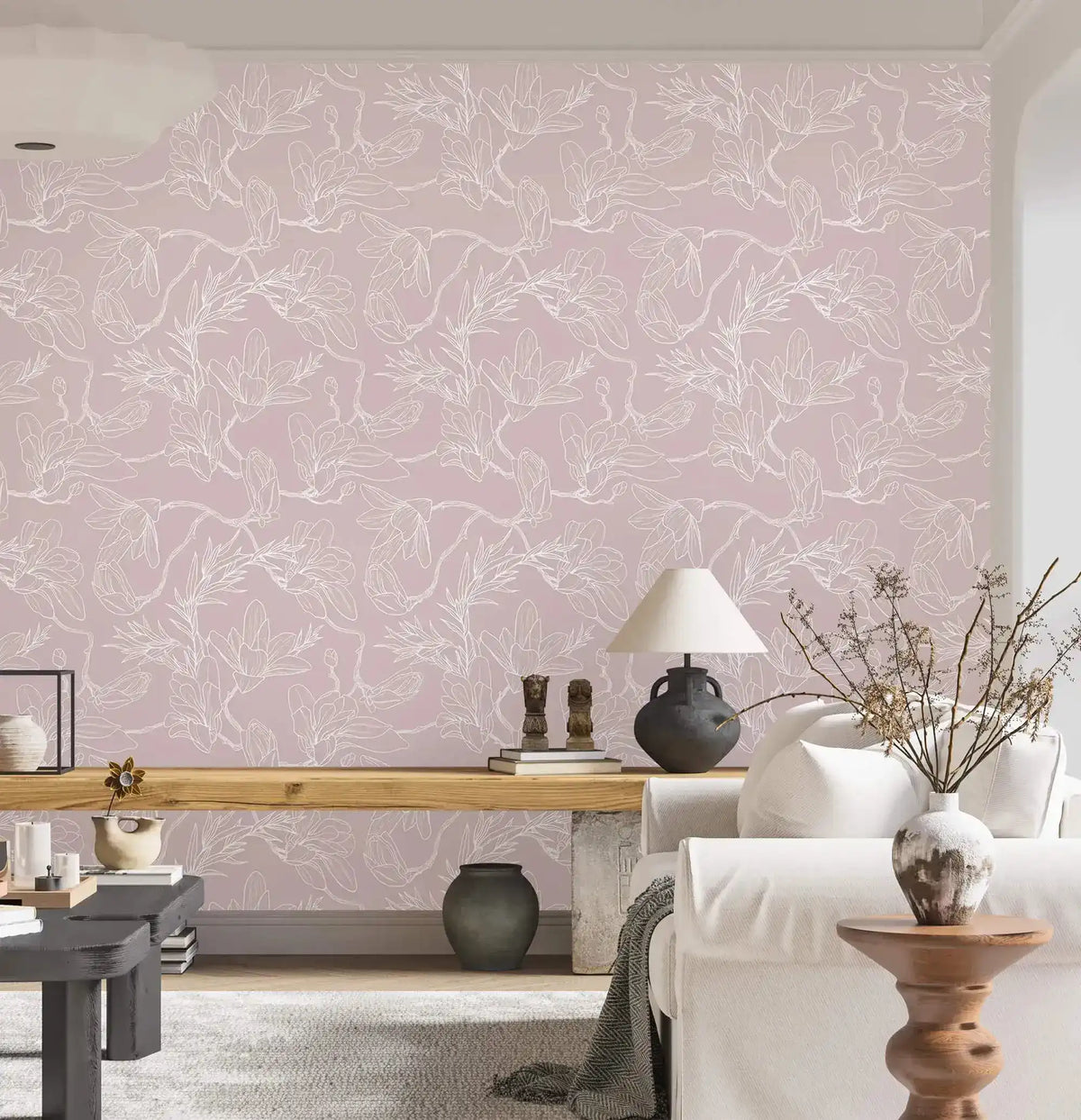 White sofa and wood bench against pink floral sketch wallpaper of white outlined flowers