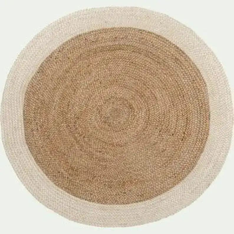 Top view of a round jute area rug with a white trim, perfect for enhancing the aesthetic of an office or dining room. This natural fiber jute rug adds a touch of elegance and warmth, making it an ideal choice for office rugs or dining room carpets.