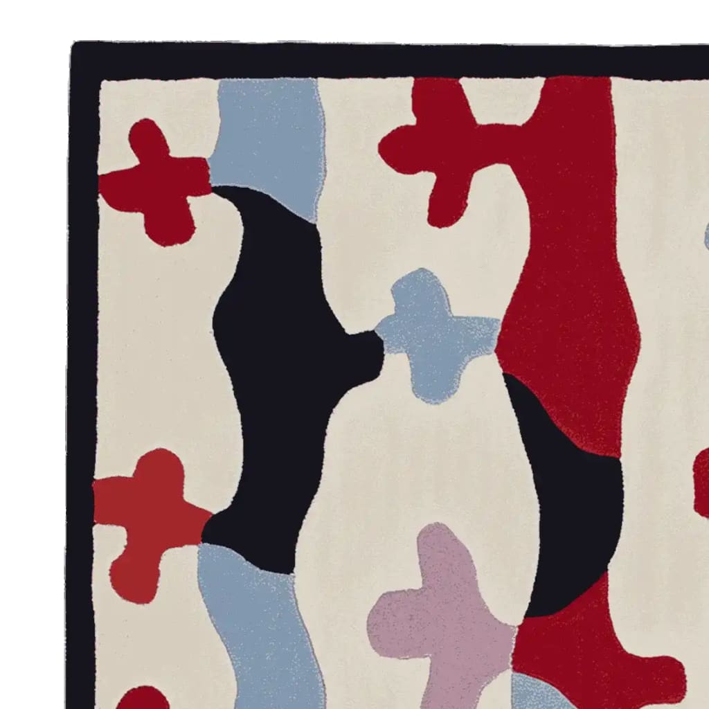A vibrant hand-tufted area rug with a contemporary abstract design. Featuring bold colors like red, black, blue, and lavender on a cream background, this wool rug adds a modern touch to any living room. Perfect for those seeking unique area rugs for living room decor.