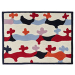 A vibrant hand-tufted area rug featuring a playful and abstract pattern in bold colors like red, orange, and blue. This contemporary wool rug adds a splash of color and modern design to any living room, perfect for those seeking unique area rugs for their space.