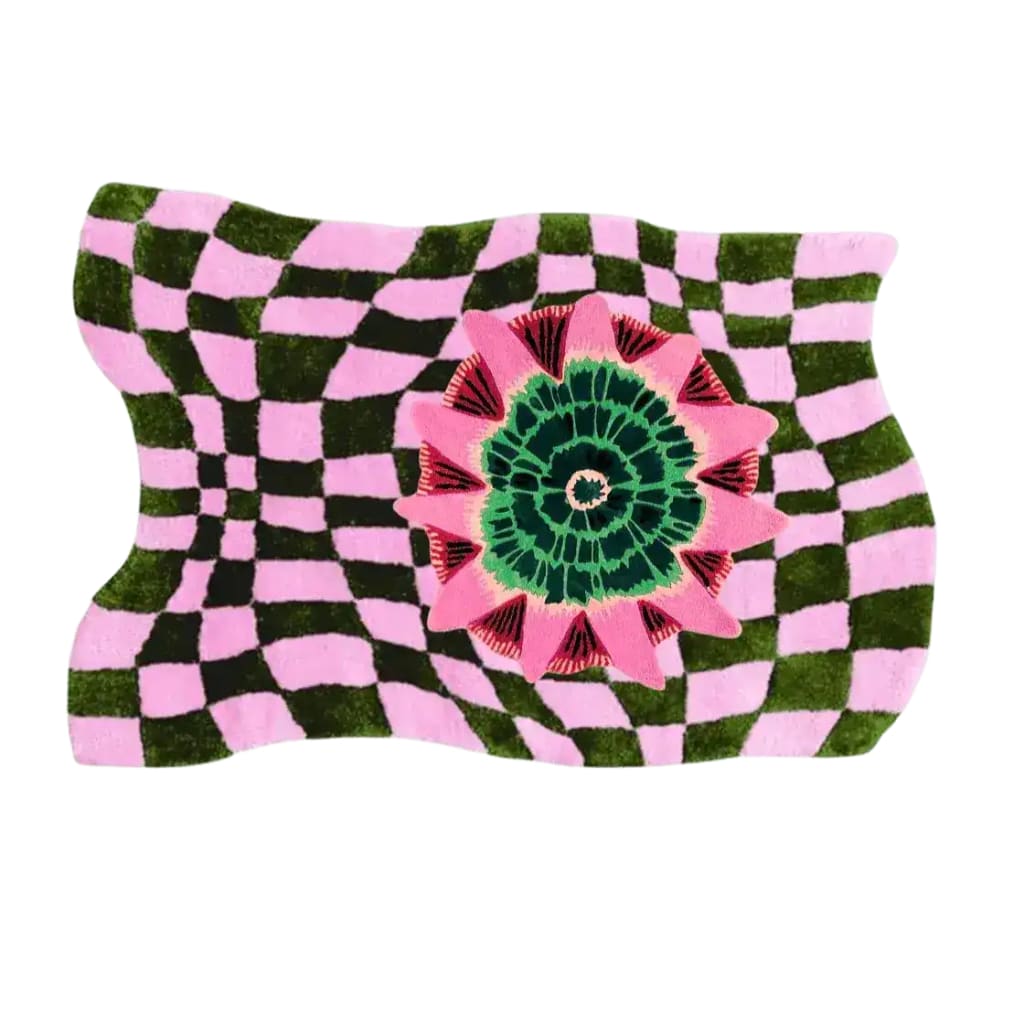 A vibrant hand-tufted wool area rug featuring a wavy checker pattern in green and pink with a bold floral design in the center. This contemporary boho rug is perfect for adding a unique touch to living room decor, combining modern artistry with cozy comfort.
