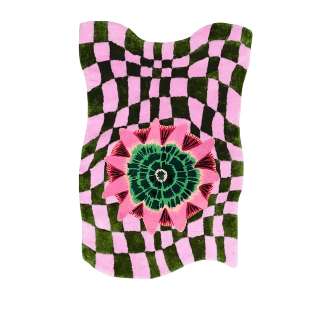 Vibrant area rug with a wavy checker pattern in black and pink, featuring a central floral design in green and pink. This hand-tufted wool rug adds a contemporary and boho touch, perfect for enhancing the decor of any living room.