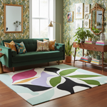 Living room with a green sofa, colorful rug, and decorative elements.
