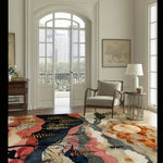 The Wildlife Horizon Square Hard Viscose Tuft Rug beautifully complements a bright living room with a large window, featuring an abstract design in vibrant colors. This wool rug serves as a stunning square area rug, ideal for both living room and dining room settings, including formal dining room rugs and dining room carpets.