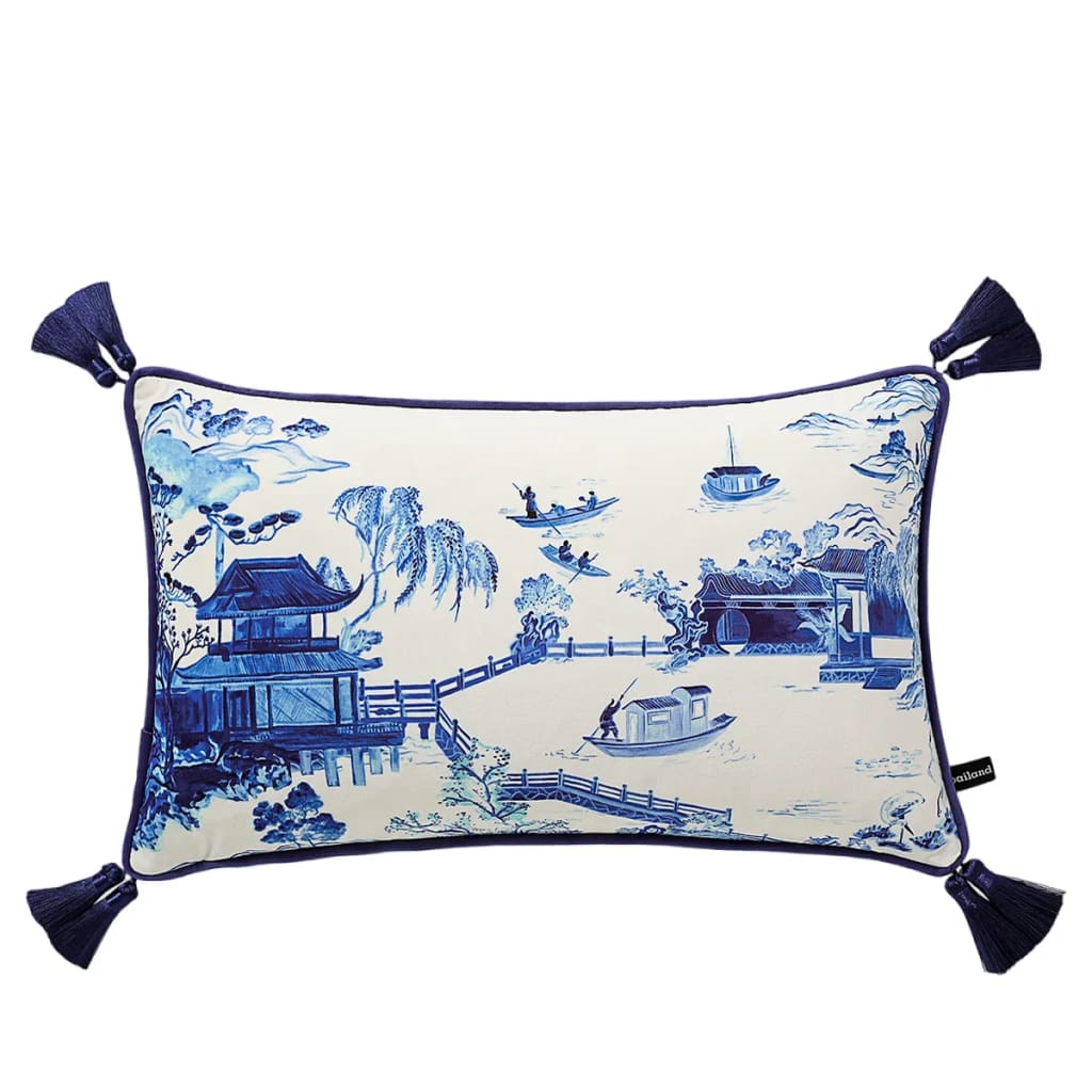 Willow Dynasty toile throw pillow cover featuring a scenic blue and white design with tassels, perfect for adding elegance to any decor.