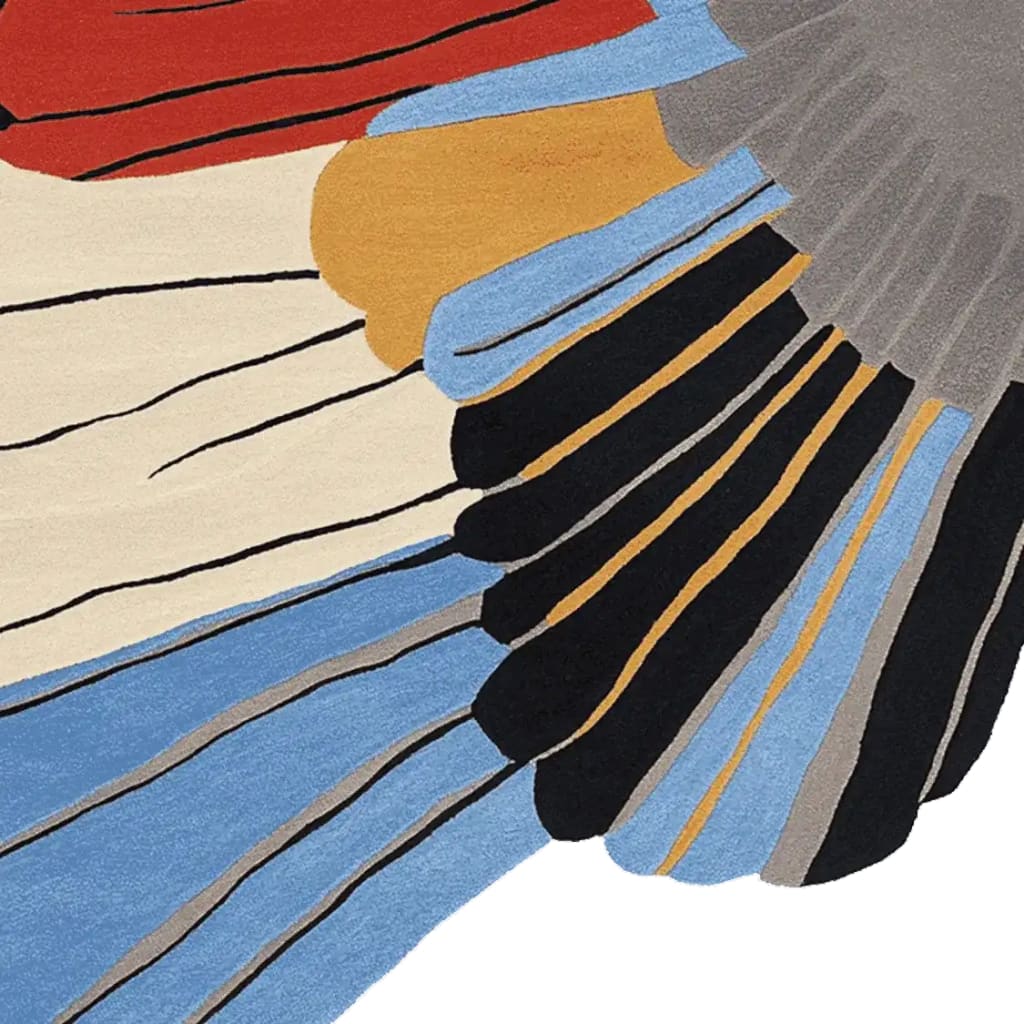 Close-up of the Winged Motion Form Hand Tufted Rug showcasing its vibrant colors and abstract design. This contemporary square area rug, perfect for large living rooms, features bold hues of red, blue, black, and beige, highlighting its wool texture. Ideal for those seeking a unique wool rug for their living space.