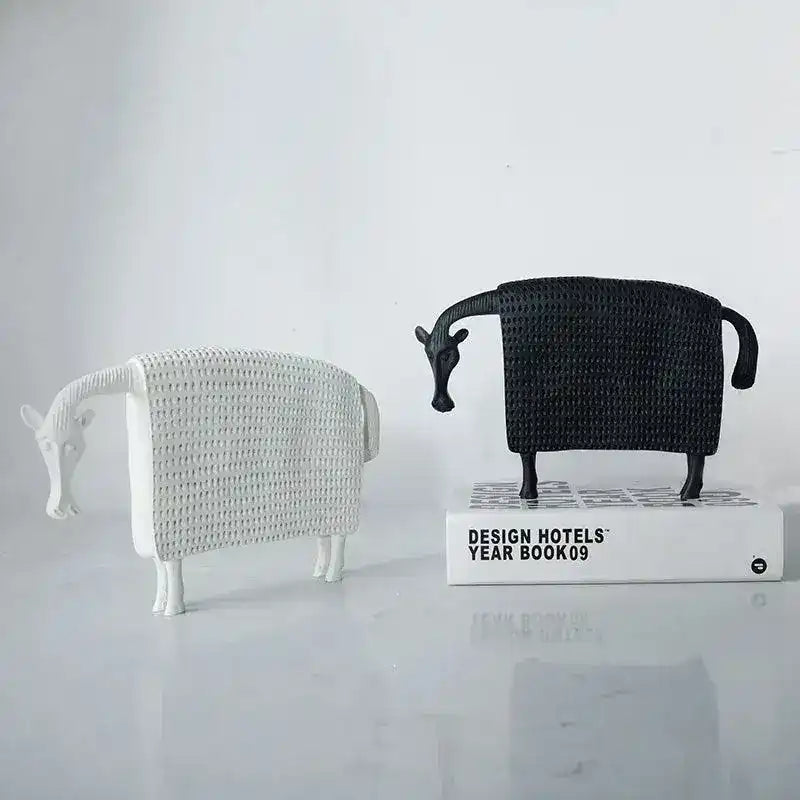 Pair of winter horse sculptures in white and black woven texture finish, standing on marble surface, front view