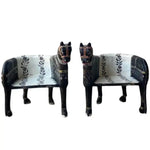 Pair of Wooden Horse Maharaja Chairs — black lacquered carved wood with white floral-embroidered seat, front view.